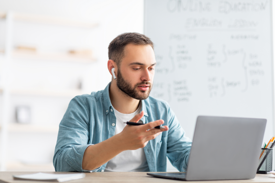 worker takes online English language training course
